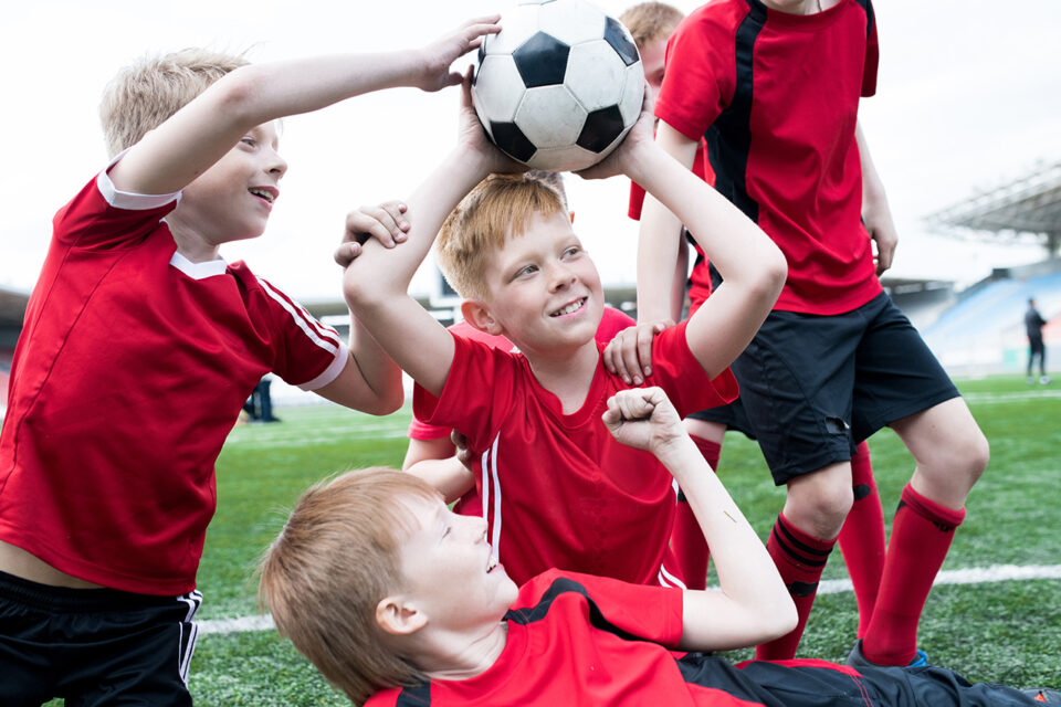 football-team-cheering-holding-ball-2022-02-02-04-49-22-utc